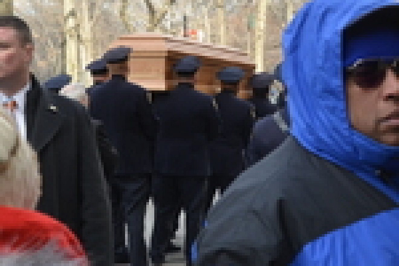 Click photo to download. Caption: On Monday, the casket of the late New York mayor Ed Koch is placed in the hearse that would carry his body to Trinity Cemetery in upper Manhattan for his Jewish burial. Credit: Maxine Dovere.