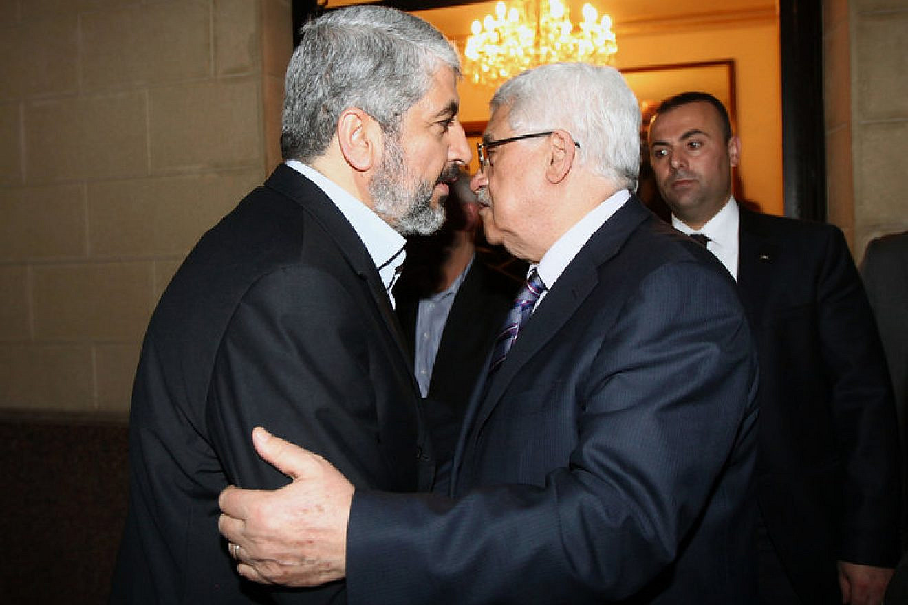 Hamas leader Khaleed Meshaal (left) meets with Palestinian Authority leader Mahmoud Abbas in Cairo, to implement the terms of a reconciliation deal they signed in the Egyptian capital in May 2011, which called for an interim government and general elections in a year, on Feb. 23, 2012. Photo by Mohammed al-Hums/Flash90.