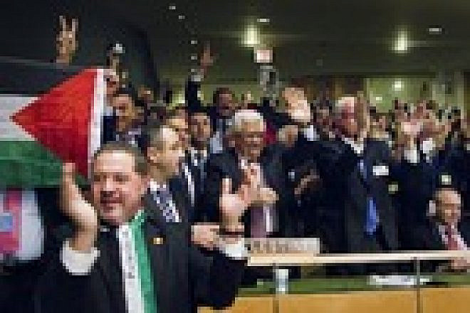 Click photo to download. Caption: Members of the Palestinian delegation at the United Nations General Assembly celebrate Nov. 29 upon the vote to upgrade Palestinian status to a non-member observer state Nov. 29. Credit: UN Photo/Rick Bajornas.