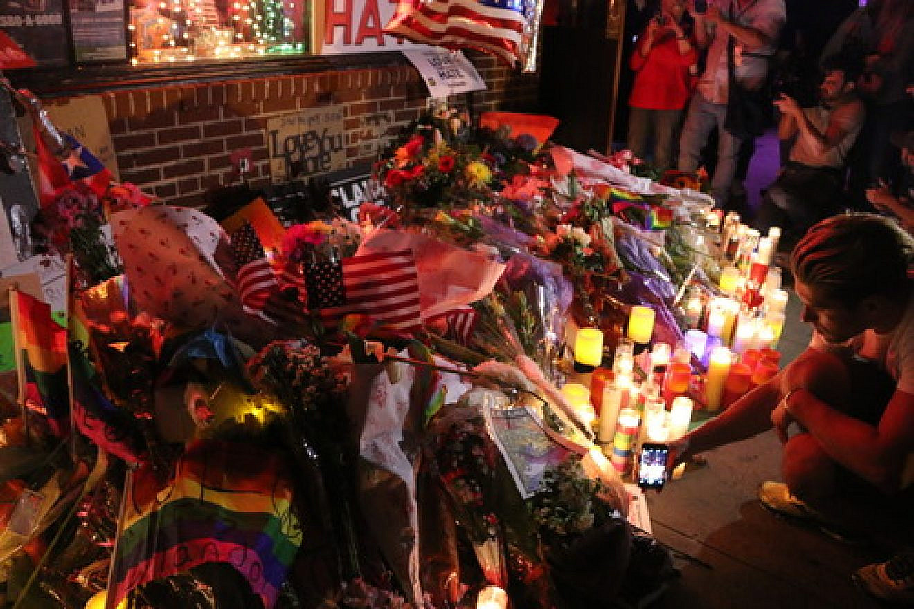 Click photo to download. Caption: A vigil for the victims of the Orlando nightclub shooting in New York City. Credit: Elisa S via Wikimedia Commons.