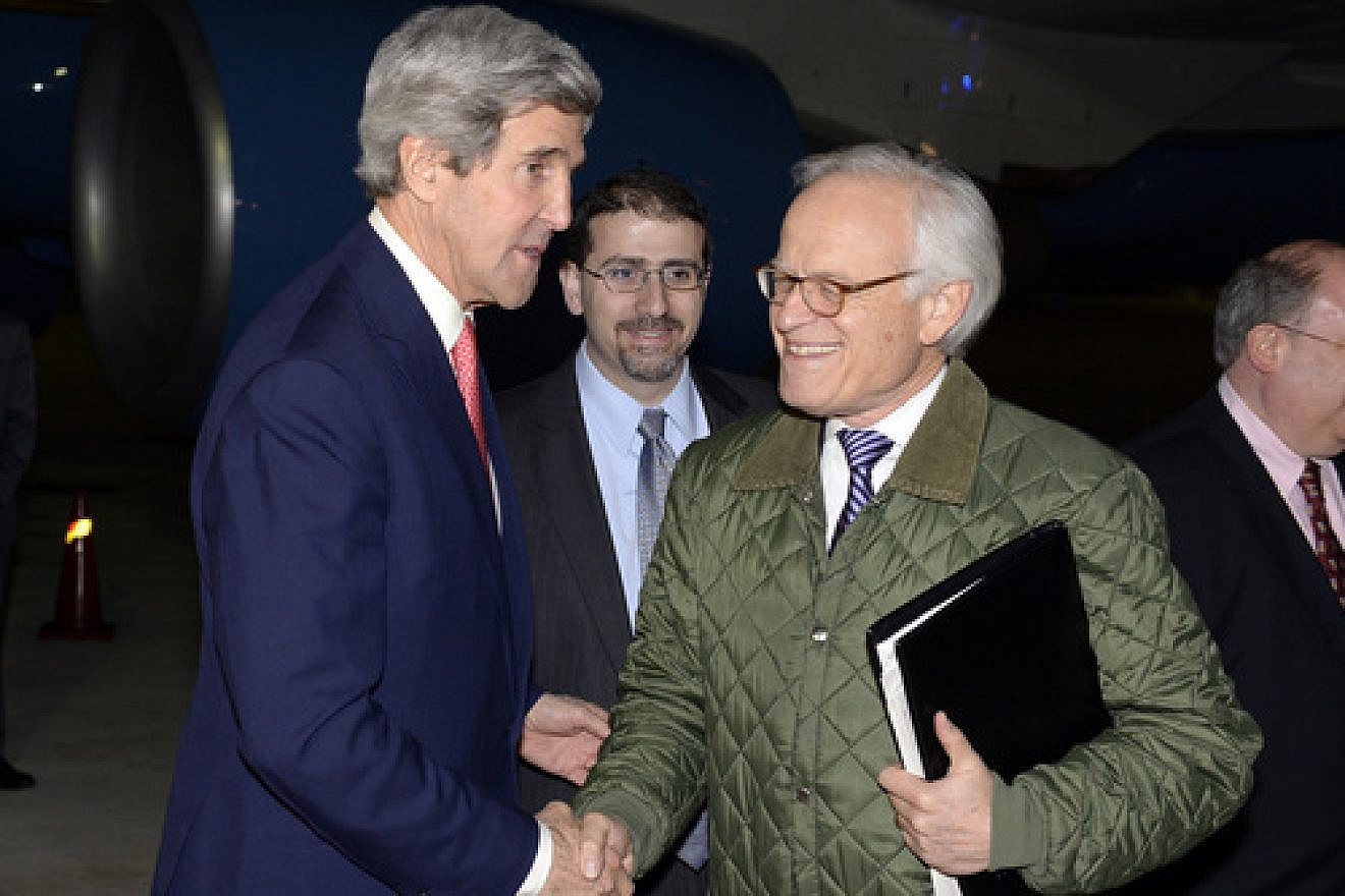 U.S. Special Envoy for Israeli-Palestinian Negotiations Martin Indyk shakes hands with U.S. Secretary of State John Kerry at Israel's Ben-Gurion International Airport, Jan. 5, 2014. Credit: Matty Stern/U.S. Embassy Tel Aviv/Flash90.