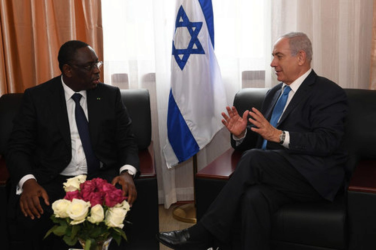 Israeli Prime Minister Benjamin Netanyahu (right) meets with Senegalese President Macky Sall on the sidelines of the Economic Community of West African States conference Sunday. Israel and Senegal agreed to restore full diplomatic ties. Credit: Kobi Gideon/GPO.