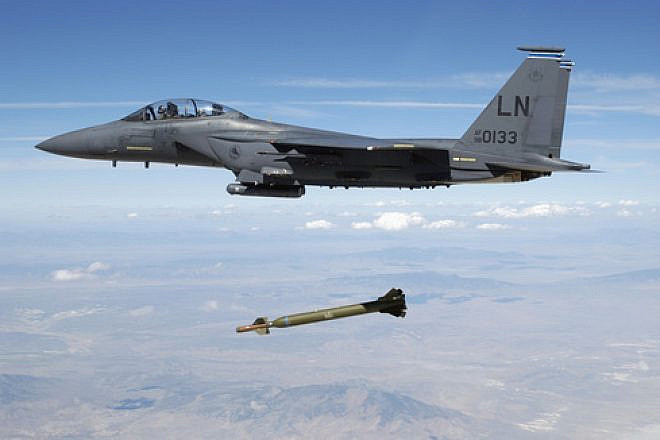 A U.S. Air Force F-15E Strike Eagle aircraft releases a GBU-28 ”bunker buster” 5,000-pound laser-guided bomb over the Utah Test and Training Range. Credit: TSGT Michael Ammons, USAF via Wikimedia Commons.