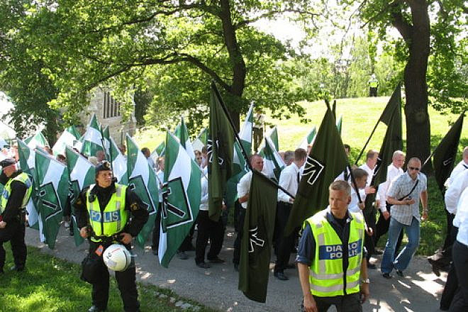 Click photo to download. Caption: Members of the neo-Nazi organization Swedish Resistance Movement take part in a nationalist demonstration in Stockholm on National Day, June 6, 2007. Credit: Peter Isotalo via Wikimedia Commons.