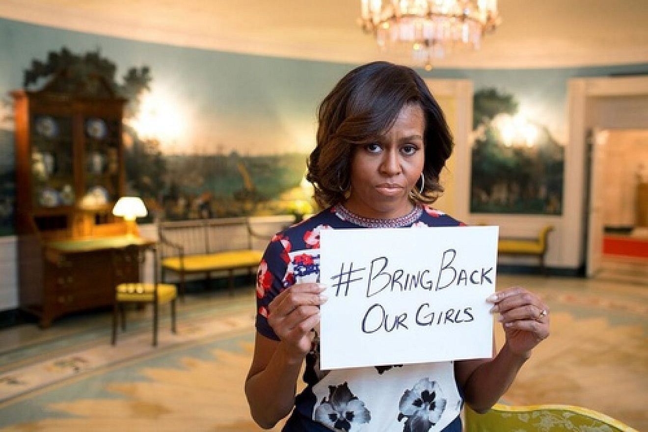 First lady Michelle Obama tweeted a photo of herself holding a sign reading #BringBackOurGirls. Source: Twitter.