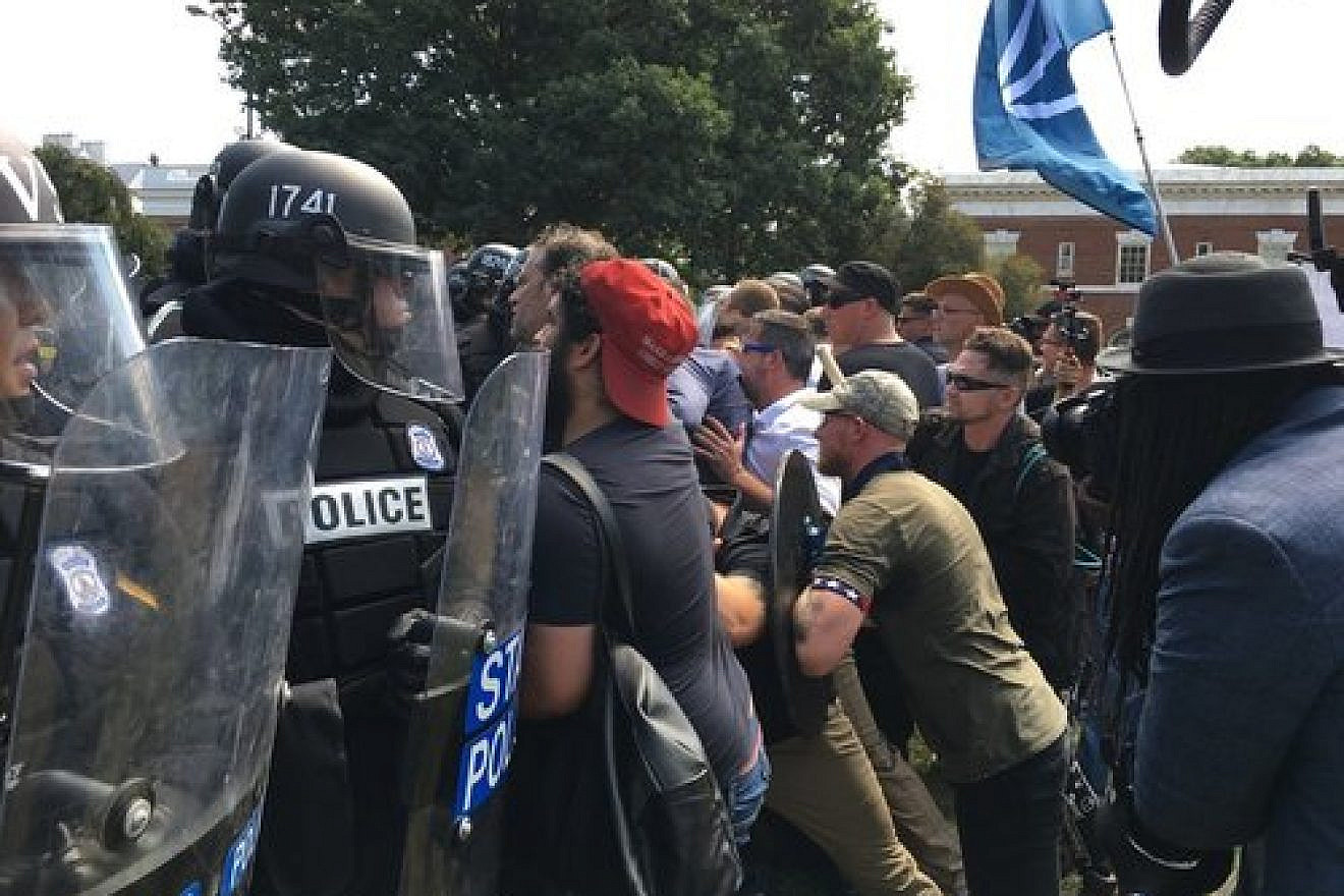 White-supremacist protesters clash with police in Charlottesville, Va., on Aug. 12, 2017. Credit: Evan Nesterak via Wikimedia Commons.