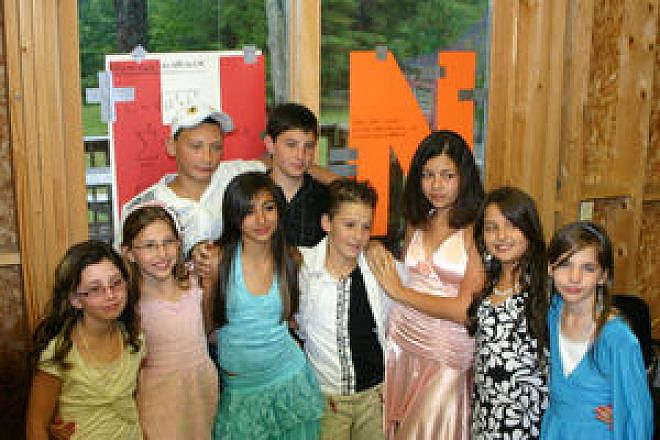 Nine children from the southern Israeli city of Sderot spent three weeks in 2007 at Camp Sunapee in Georges Mills, N.H. Credit: Courtesy of Diana Burmistrovich.