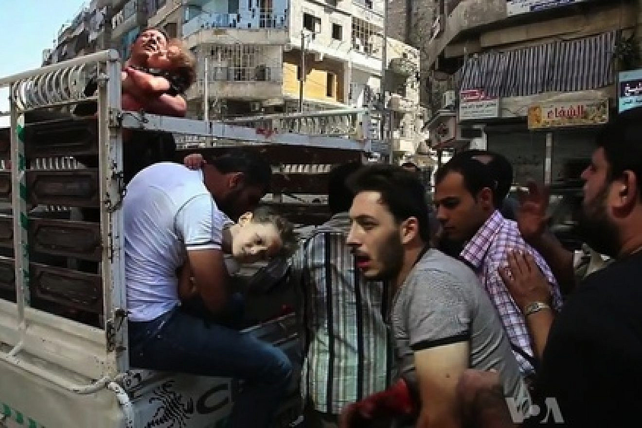 Wounded civilians arrive at a hospital in Aleppo during the Syrian civil war. Credit: Voice of America News/Scott Bob via Wikimedia Commons.