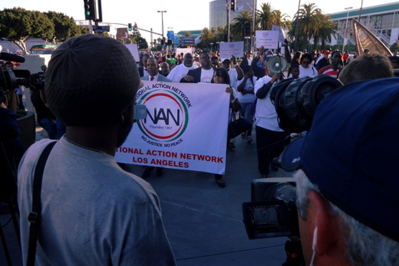Click photo to download. Caption: National Action Network Los Angeles participants march alongside Staples Center in Los Angeles in reaction to the Donald Sterling scandal on April 29. Credit: Craig Dietrich via Wikimedia Commons