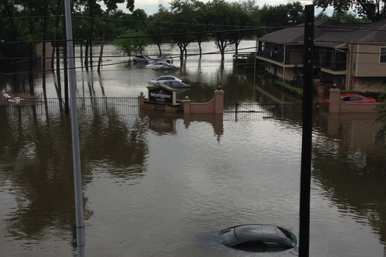 Click photo to download. Caption: The flooded street outside of the Houston apartment building of JNS.org's Jacob Kamaras on April 18, 2016. Credit: Jacob Kamaras.
