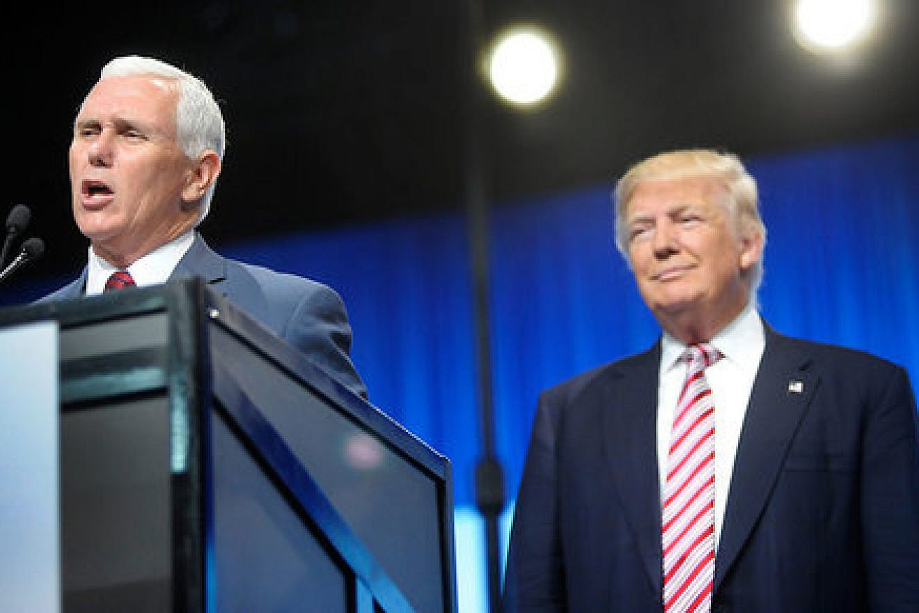 Republican presidential nominee Donald Trump watching his vice-presidential running mate Mike Pence give a speech. Credit: Getty Images.
