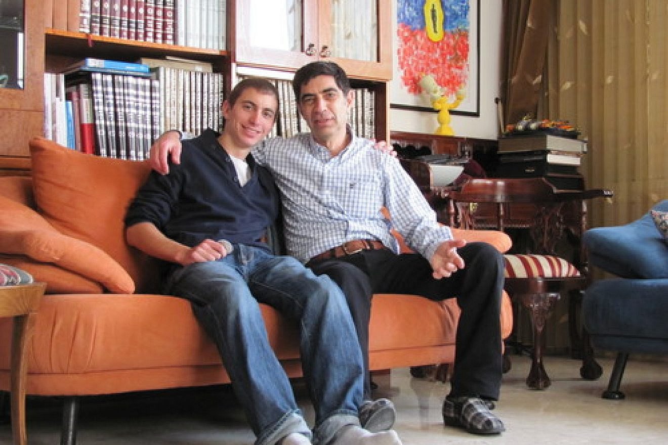 The late Hadar Goldin (left) with his father, Simcha. Credit: Courtesy of the Goldin family.
