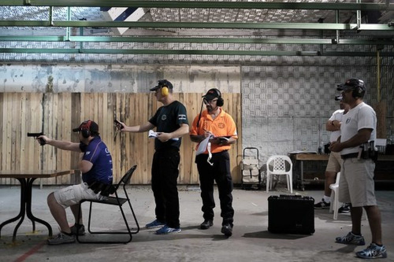 Click photo to download. Caption: During the practical shooting exercise pictured here, more than 200 people from 12 different shooting clubs gathered at the Olympic Shooting Range in Herzliya, Israel, last October to take part in a variety of shooting situations resembling real-life scenarios. Credit: Tomer Neuberg/Flash90.