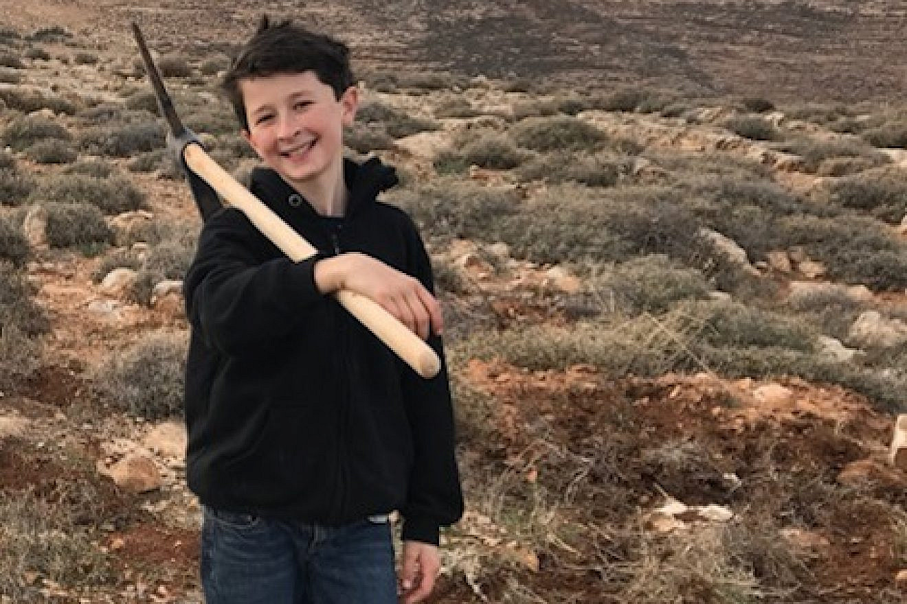 Lavi Gimpel at the site of the farm his family is establishing in the Judean Hills. Credit: Courtesy of Gimpel family.