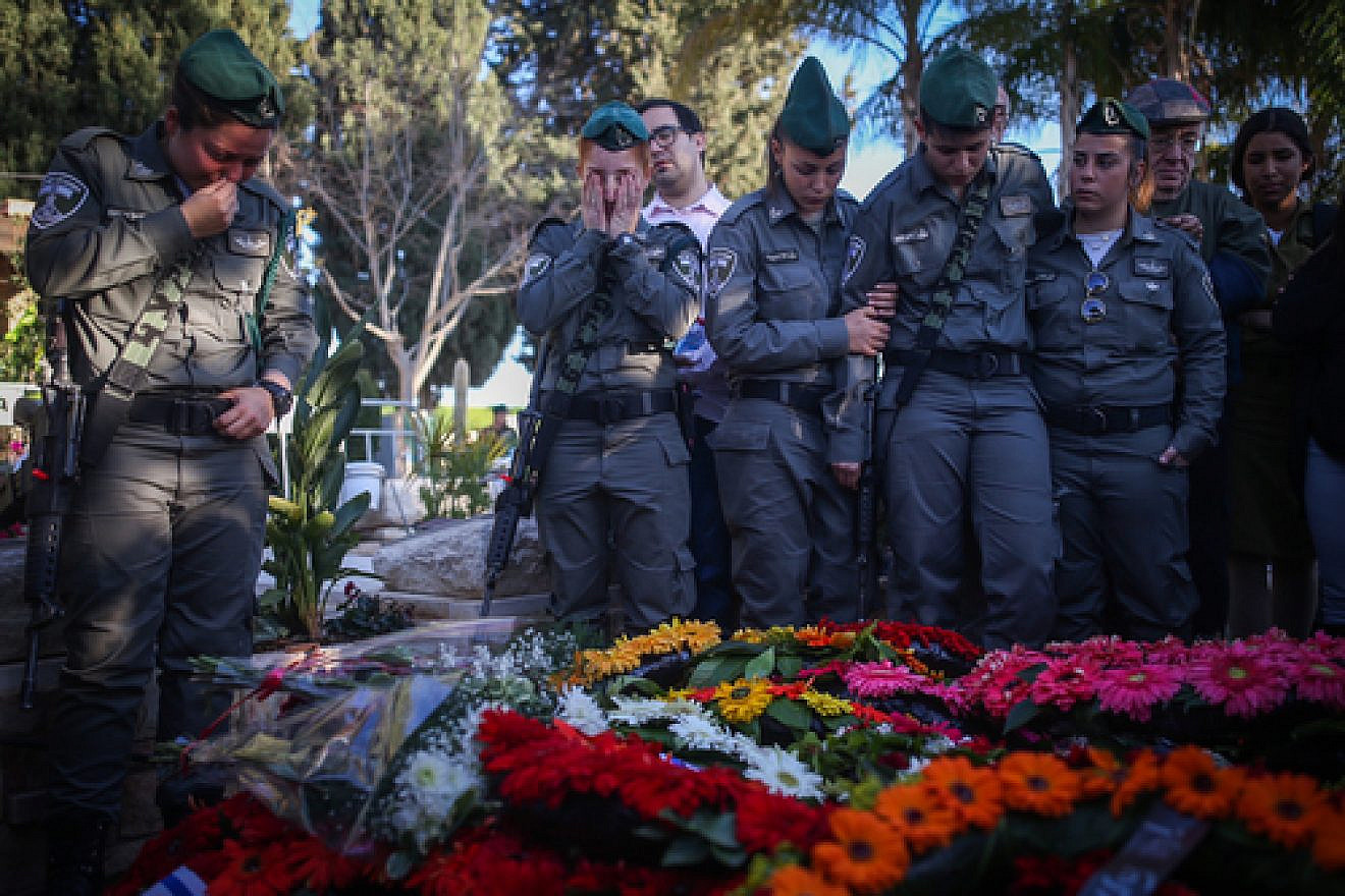 Click photo to download. Caption: Friends and relatives attend the funeral of slain Israeli Border Police officer Hadar Cohen, 19, at the cemetery in Yehud in central Israel on Feb. 4. Credit: Yonatan Sindel/Flash90.