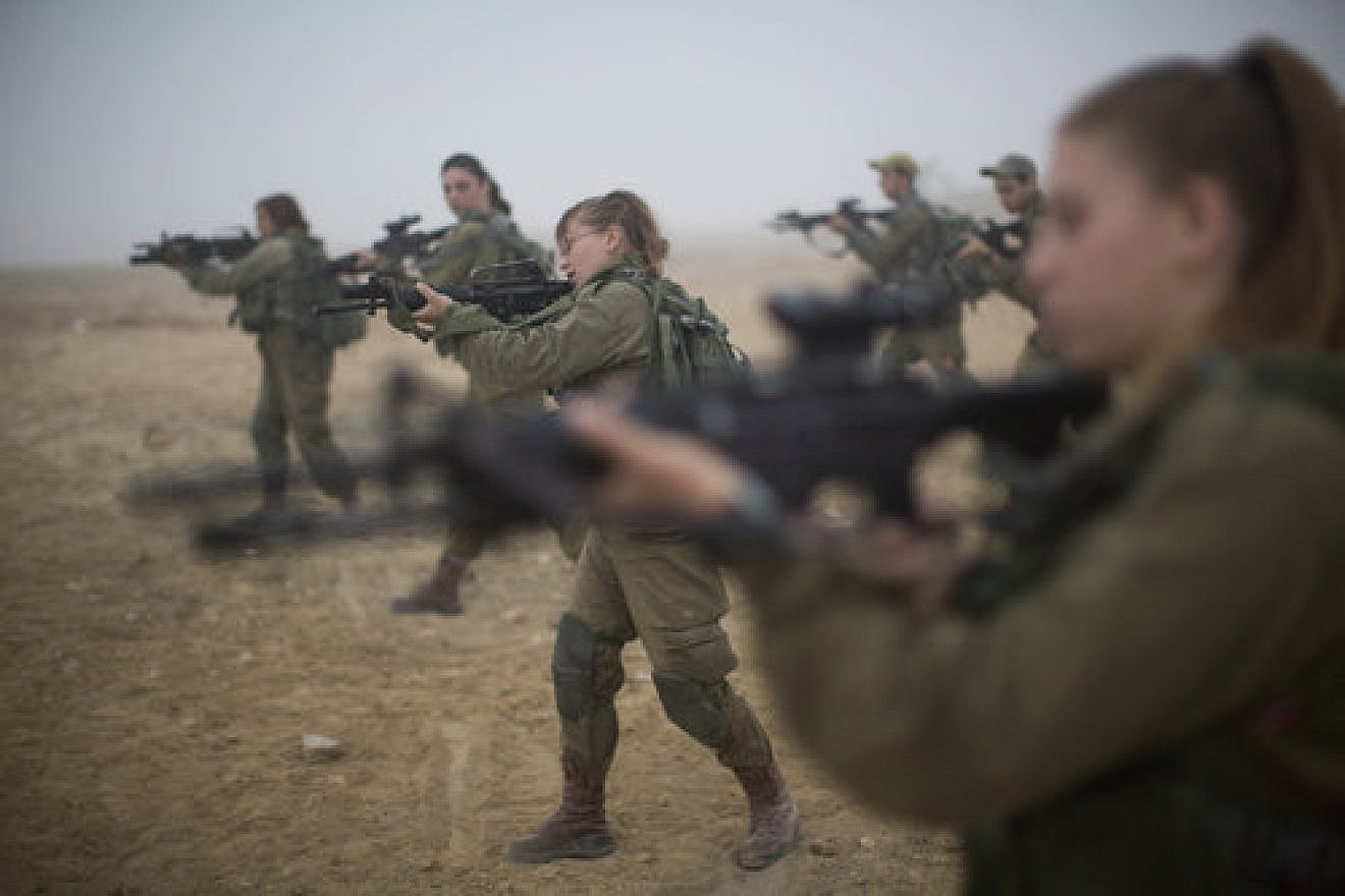 Soldiers of the IDF’s Bardales Battalion prepare for urban-warfare training on a foggy morning in southern Israel July 13, 2016. Some 51 percent of the soldiers in the Bardales Battalion, an infantry combat unit, are women. Credit: Hadas Parush/Flash90.