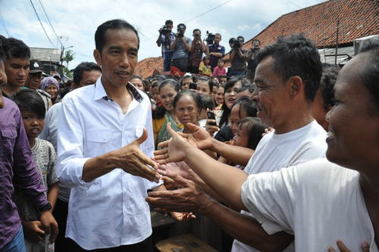 Indonesian President Joko Widodo (left) visits the country's capital of Jakarta. Credit: Jokowi Blusukan via Wikimedia Commons.