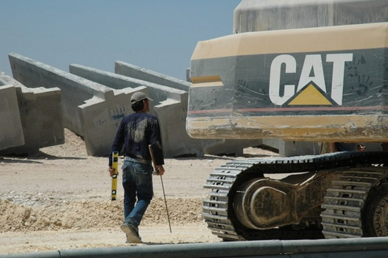 A Caterpillar bulldozer amid construction of the Israeli security fence. Credit: Justin McIntosh.