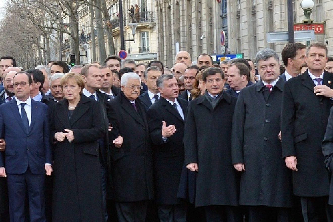 Palestinian Authority leader Mahmoud Abbas—third from left in the front row, between German Chancellor Angela Merkel and Jordan's King Abdullah at the Jan. 11 solidarity march against terrorism in Paris—condemned the attack on the French satirists at Charlie Hebdo, but recently jailed and tortured a Palestinian satirist. Credit: Haim Zach/GPO.