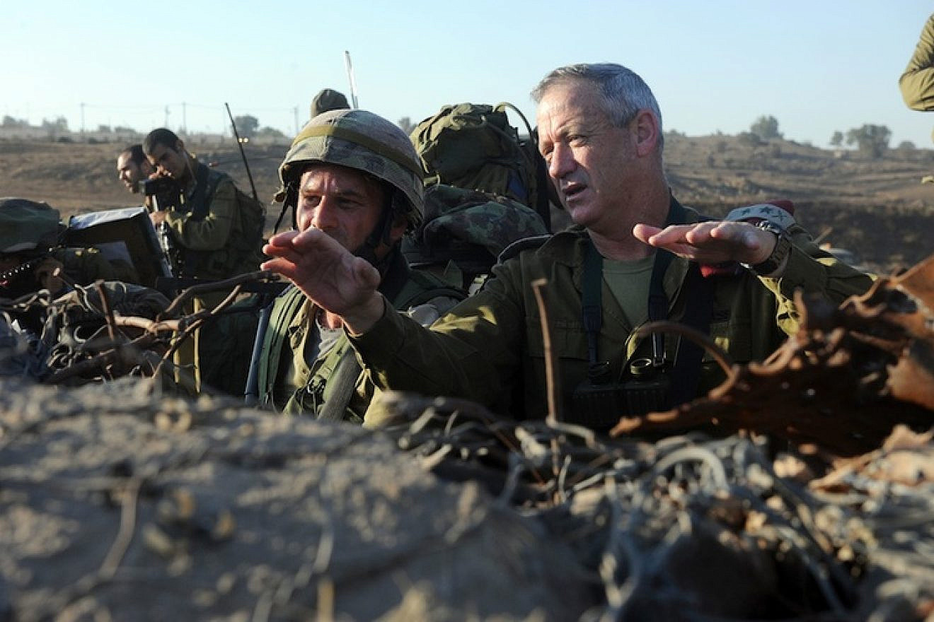 Israel Defense Forces Chief of Staff Lt. Gen. Benny Gantz (right) in action during a live-fire exercise for Israeli army battalion commanders taking place in the Golan Heights on Sept. 4, 2012. Syrian tanks entered the Golan Heights demilitarized zone, raising concerns that the ongoing civil war could spill over into Israel. After Syrian tanks entered the Golan's demilitarized zone on Nov. 3, Gantz told IDF soldiers the Syrian civil war "could turn into our affair” in Israel. Credit: Shay Wagner/IDF/Flash90.