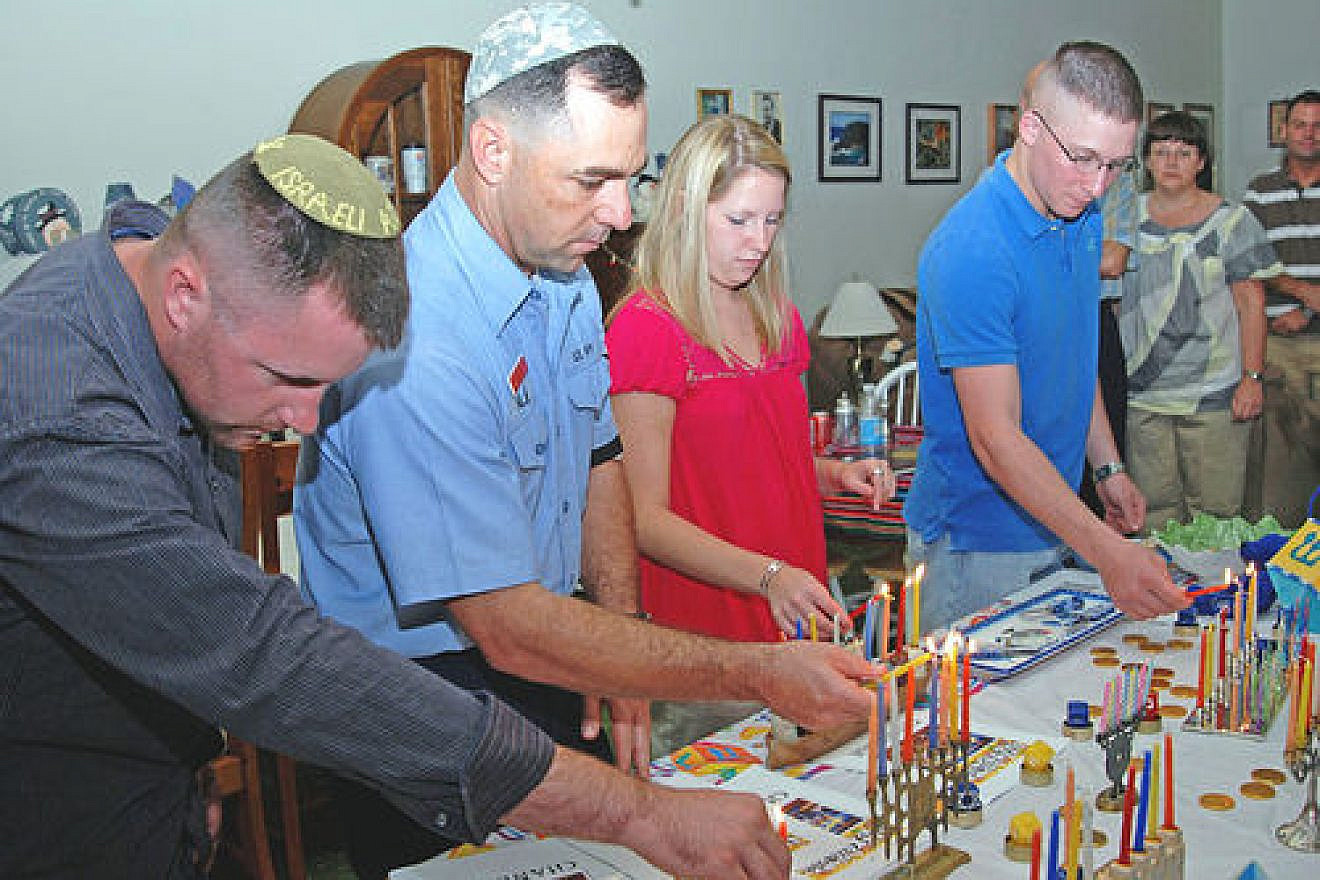 Click photo to download. Caption: U.S. Navy personnel light Hanukkah candles on Dec. 28, 2008, in Guantanamo Bay, Cuba. Credit: U.S. Navy photo by Mass Communication Specialist 1st Class Richard M. Wolff.