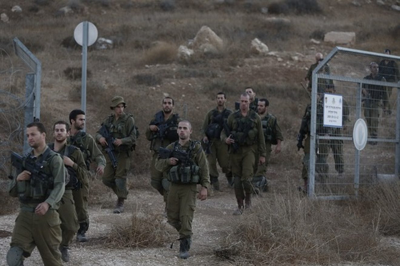 Click photo to download. Caption: Israeli soldiers are seen after searching for the remains of a drone in the Negev southern Israel on Oct. 6, 2012. Israeli jets scrambled to intercept a drone that crossed into Israeli airspace from the Mediterranean Sea, bringing it down without incident in the south of the country. Credit: Tsafrir Abayov/Flash90