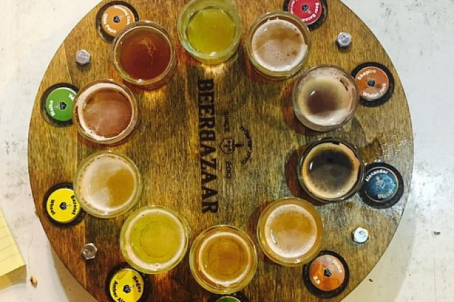 The tap wheel, giving customers a shot each of 10 beers, at the Beer Bazaar in Jerusalem's  Machane Yehuda outdoor market. Credit: Maayan Jaffe-Hoffman.