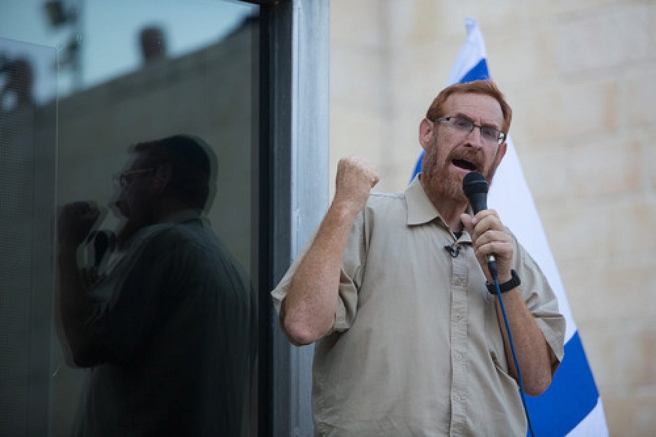 Click photo to download. Caption: Rabbi Yehudah Glick speaks during a protest outside the Temple Mount in Jerusalem on July 14, 2015, following the closing of the Temple Mount to Jews until the end of the Muslim holy month of Ramadan. Credit: Yonatan Sindel/Flash90.