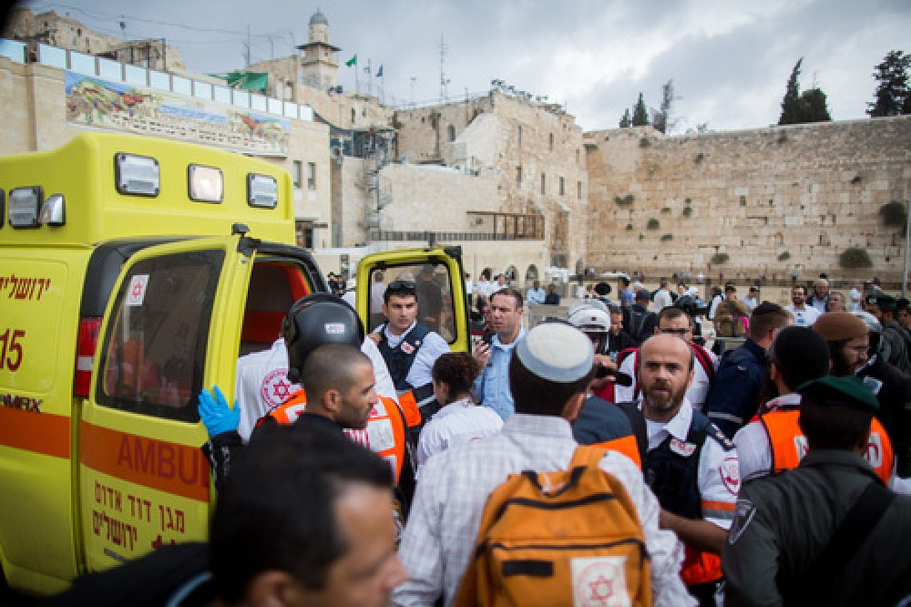 Click photo to download. Caption: Ambulances at the Western Wall evacuate injured Israelis following a terror attack in which a Palestinian woman stabbed a Jewish man near the Lions’ Gate of Jerusalem's Old City on Oct. 7, 2015. Credit: Yonatan Sindel/Flash90.