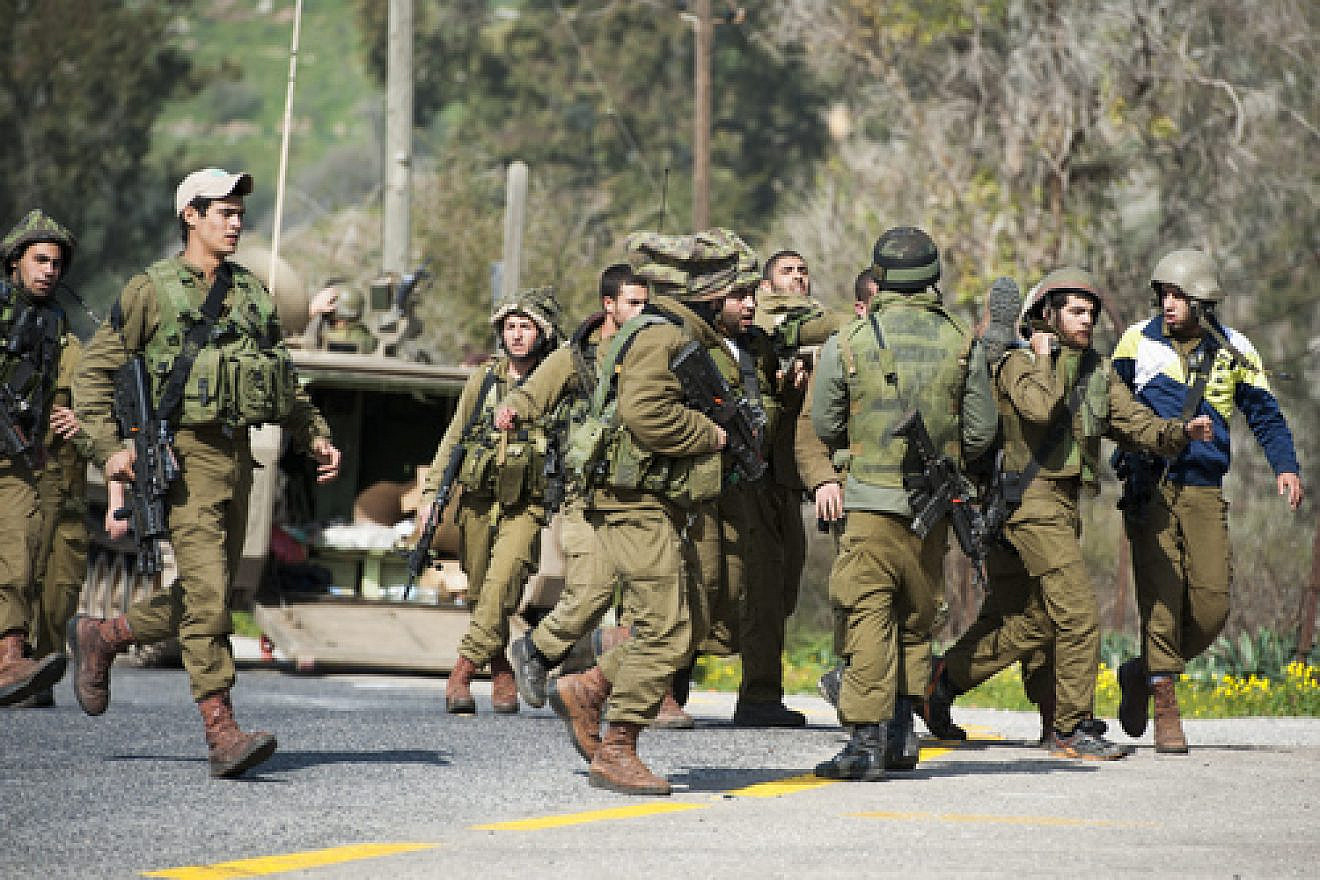 Israeli soldiers in the northern Mount Dov region after an Israel Defense Forces' patrol came under anti-tank fire from Hezbollah terrorist operatives. The Hezbollah attack killed two Israeli soldiers and injured seven others, Jan. 28, 2018. Credit: Basal Awidat/Flash90.