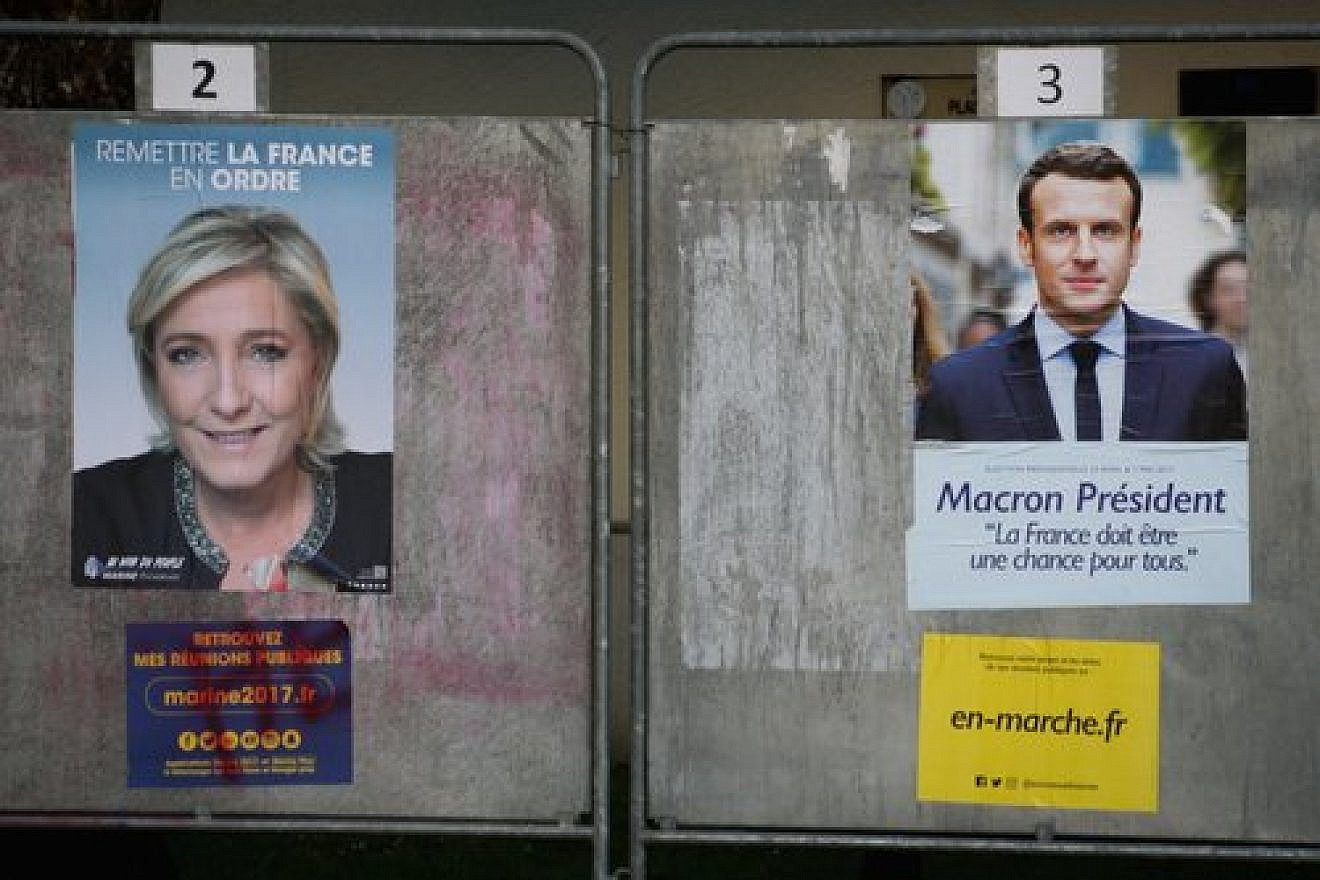 Posters showing French presidential candidates Marine Le Pen (left) and Emmanuel Macron outside a polling station in Cesson, France, April 23. Credit: Marion Sindel/Flash90.