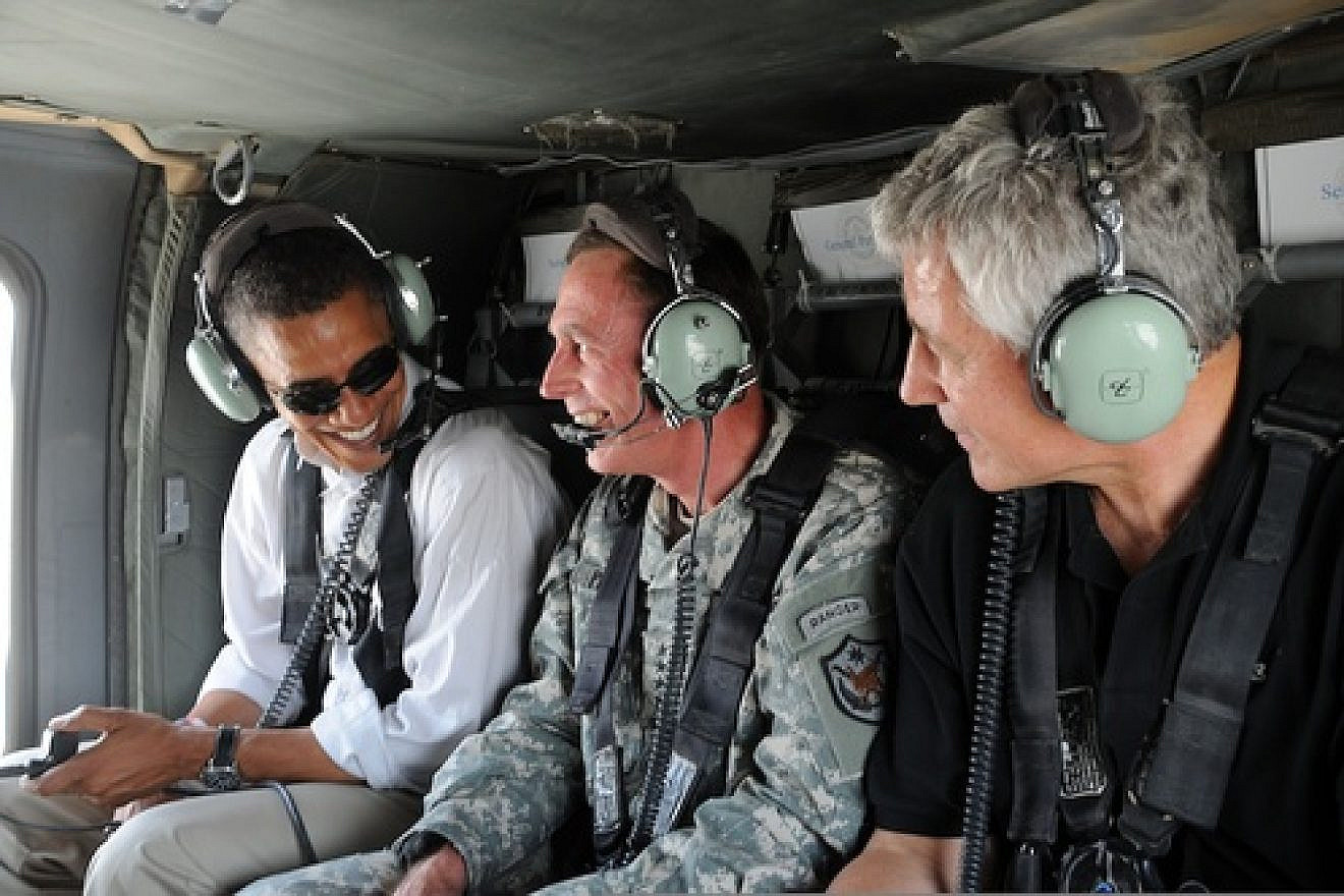 Click photo to download. Caption: In July 2008, U.S. Army Gen. David H. Petraeus (center), then commander of Multi-National Force-Iraq, gives an aerial tour of Baghdad to then Senators Barack Obama (far left) and Chuck Hagel (far right). Credit: U.S. Air Force/Staff Sgt. Lorie Jewell.