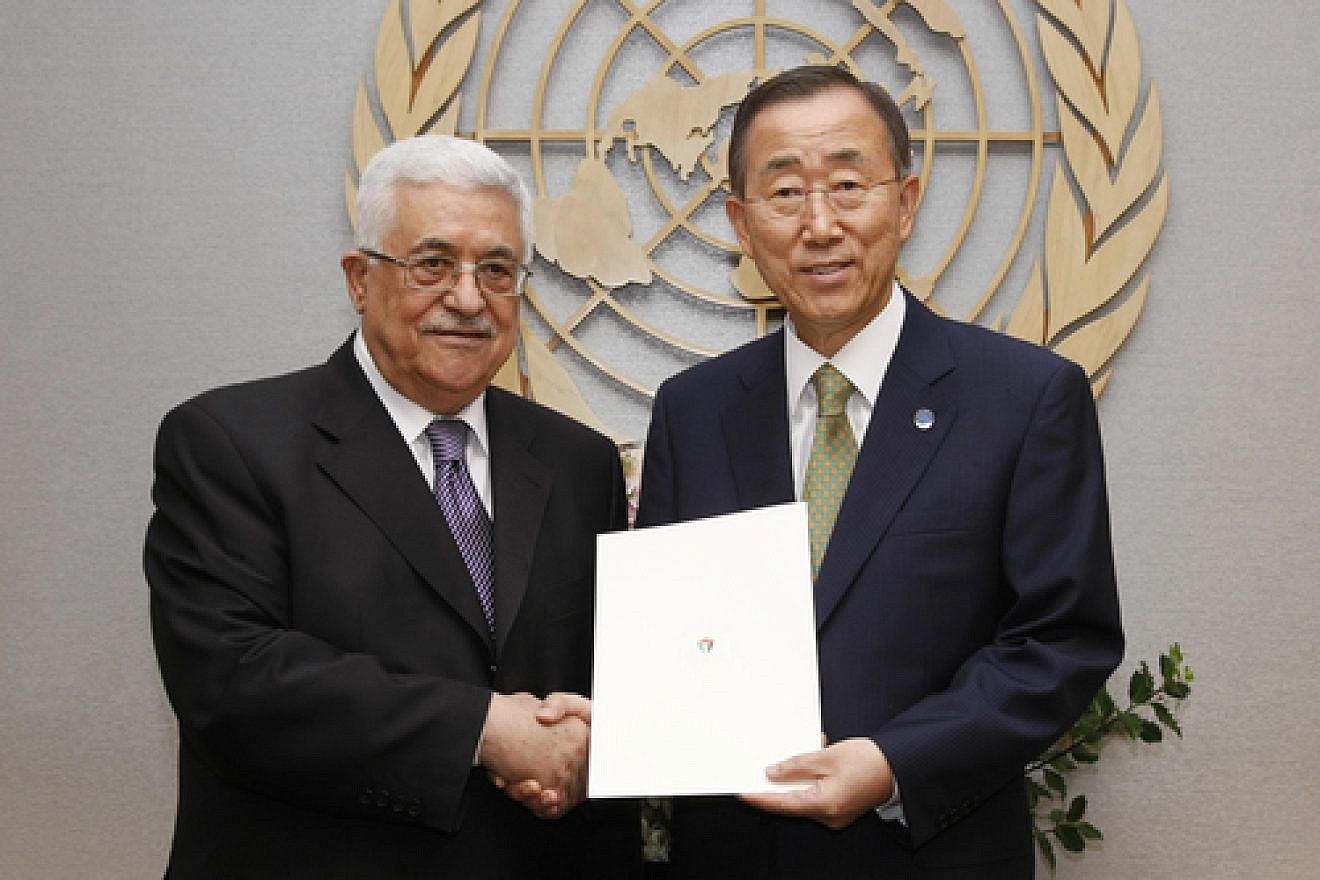 U.N. Secretary-General Ban Ki-moon (right) and Palestinian Authority leader Mahmoud Abbas pose for a photograph in September 2011 after Abbas submitted a formal application for P.A. .status as a U.N. member state. In early January 2015, Ban announced the approval of the P.A.'s request to join the U.N.-affiliated International Criminal Court, a body through which the P.A. intends to bring war crimes charges against Israel. Credit: U.N. Photo/Paulo Filgueiras.