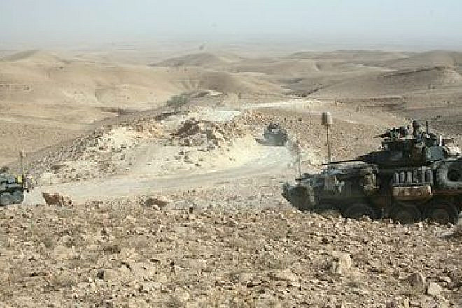 In July 2009, light-armored vehicles with U.S. Marine Corps' Task Force 3rd Light Armored Reconnaissance Battalion, Regimental Combat Team 8, traverse the rocky terrain of the Sinjar Mountains while deployed to the Nineveh province in Iraq. Credit: Sgt. Eric C. Schwartz via Wikimedia Commons.
