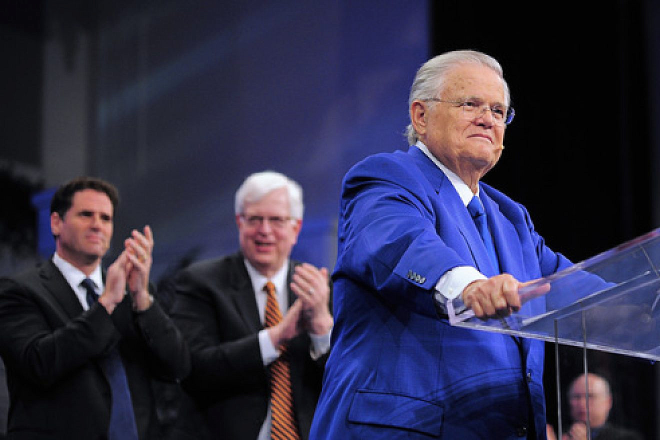 Christians United for Israel founder Pastor John Hagee addresses the 33rd annual "A Night to Honor Israel" in San Antonio on Sunday. Behind him are Israeli Ambassador to the U.S. Ron Dermer (left) and popular radio talk show host Dennis Prager, who both also spoke at the event. Credit: Paul Wharton Photography.