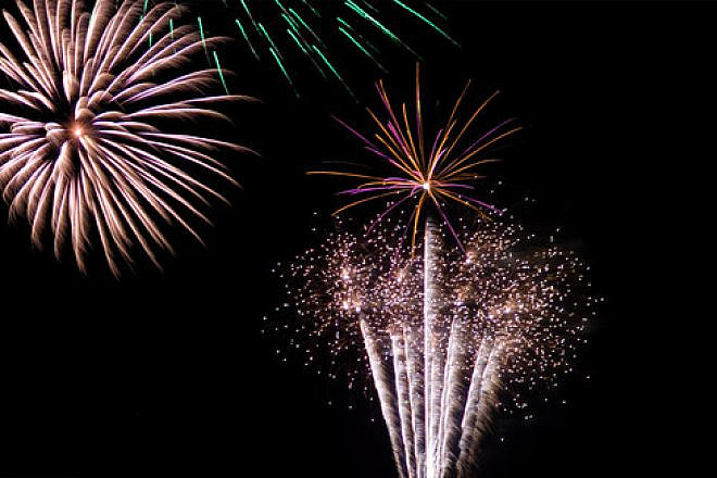 Click photo to download. Caption: New Year's fireworks. Credit: Graham Crumb via Wikimedia Commons.