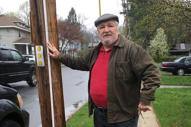 Harold Warren, second vice president of the historic Congregation Schomre Israel, stands at one of the boundaries for the new eruv in Poughkeepsie, N.Y. Credit: Courtesy of Harold Warren.