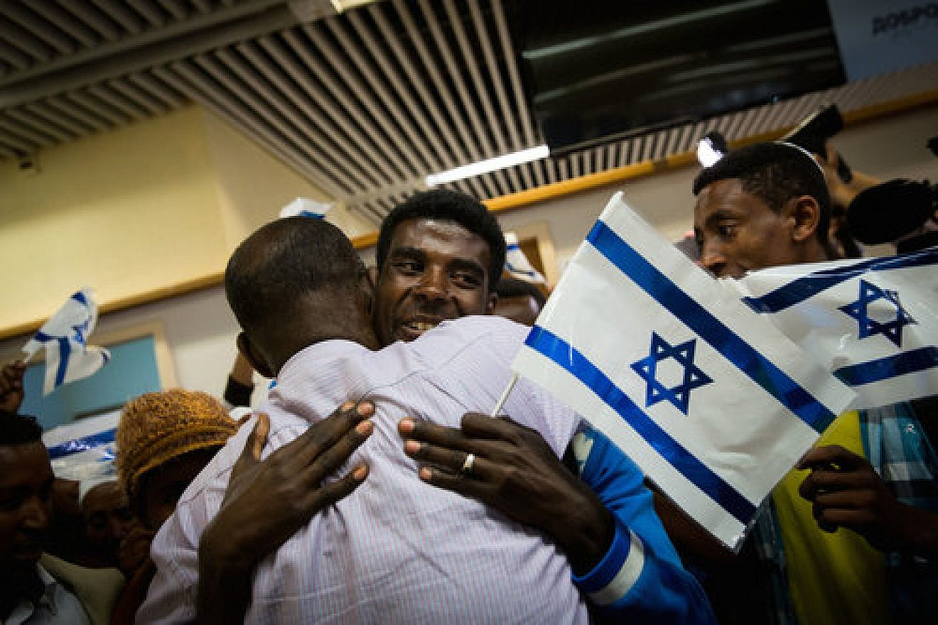 Ethiopian Jews rejoice upon their arrival in Israel Oct. 9, 2016. Israel is the only country in the world to ever sent its planes to a famine-ravaged African country such as Ethiopia to airlift tens of thousands of starving blacks to safety, notes columnist Stephen M. Flatow. Credit: Miriam Alster/Flash90.