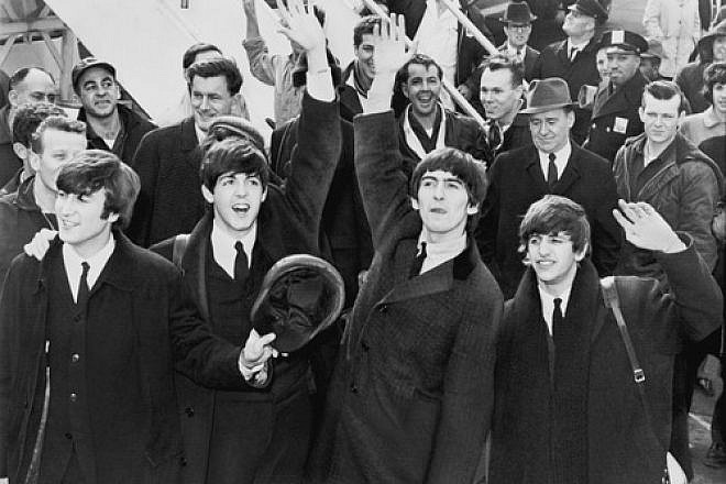 The Beatles, pictured here waving to fans after arriving at John F. Kennedy Airport in New York in February 1964, makes the JNS.org Hanukkah playlist with "Eight Days A Week." Credit: Library of Congress.