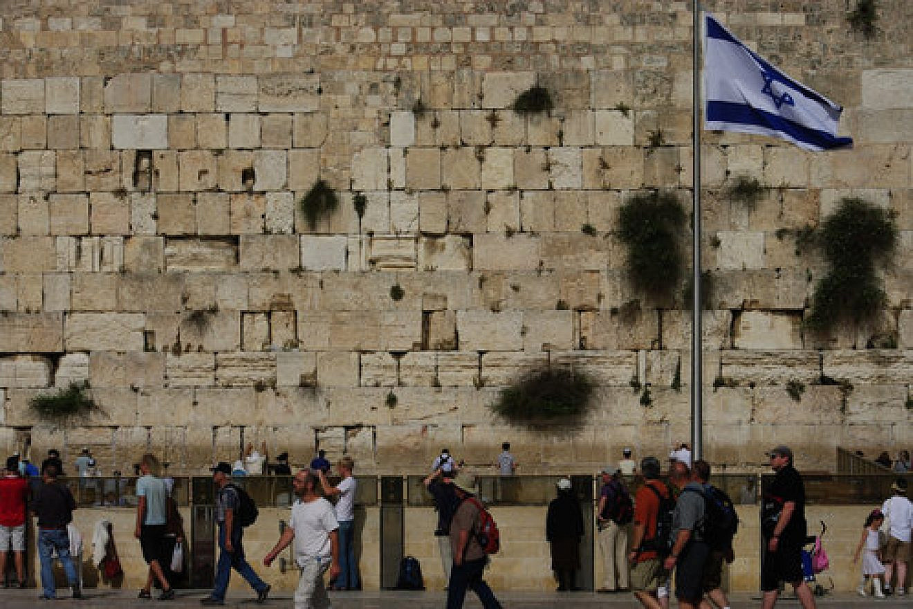 An Israeli flag at the Western Wall in Jerusalem. Credit: Emmanuel DYAN via Wikimedia Commons.