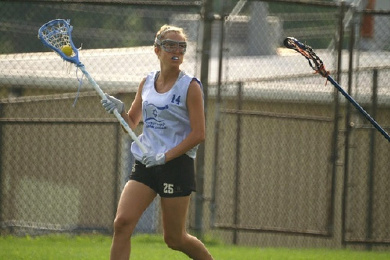 Click photo to download. Caption: Israeli women’s lacrosse team member Sara Greenberg wields her stick. Credit: Donna Pedersen.
