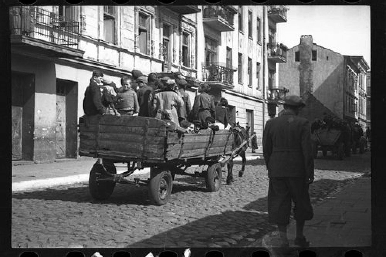 Children are transported from the Lodz Ghetto to the Nazi concentration camp of Chelmno in 1942, in one of the photos on display as part of the “Memory Unearthed: The Lodz Ghetto Photographs of Henryk Ross” exhibit. Credit: Courtesy Museum of Fine Arts, Boston.
