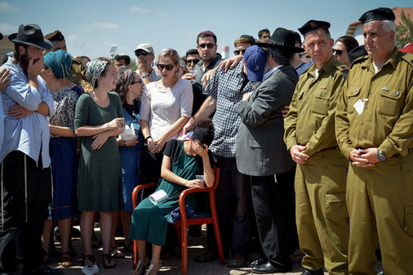 Family and friends mourn 20-year old IDF lone soldier Shlomo Rindenow at his funeral July 18, 2016. Rindenow was killed along with another Israeli soldier when a grenade accidentally exploded near an army post in the Golan Heights. Credit: Ben Drori/Flash90.