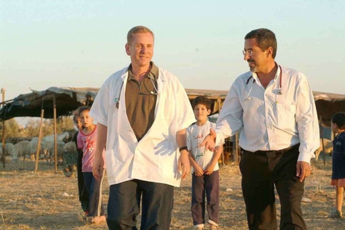 Dr. Ohad Birk (pictured in front, on the left) working with Bedouin. Birk has announced the discovery of a genetic mutation in Moroccan Jews that leads to a crippling disease he is calling PCCA2. Credit: Dani Machlis.
