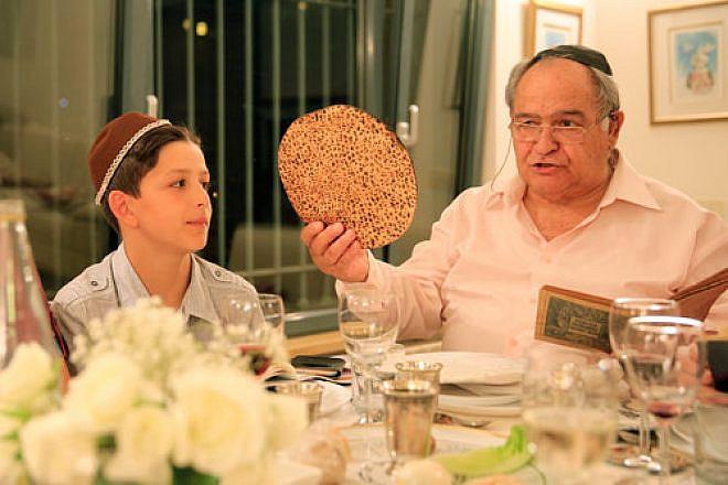 An Israeli family during a Passover seder, April 22, 2016. Credit: Nati Shohat/Flash90.
