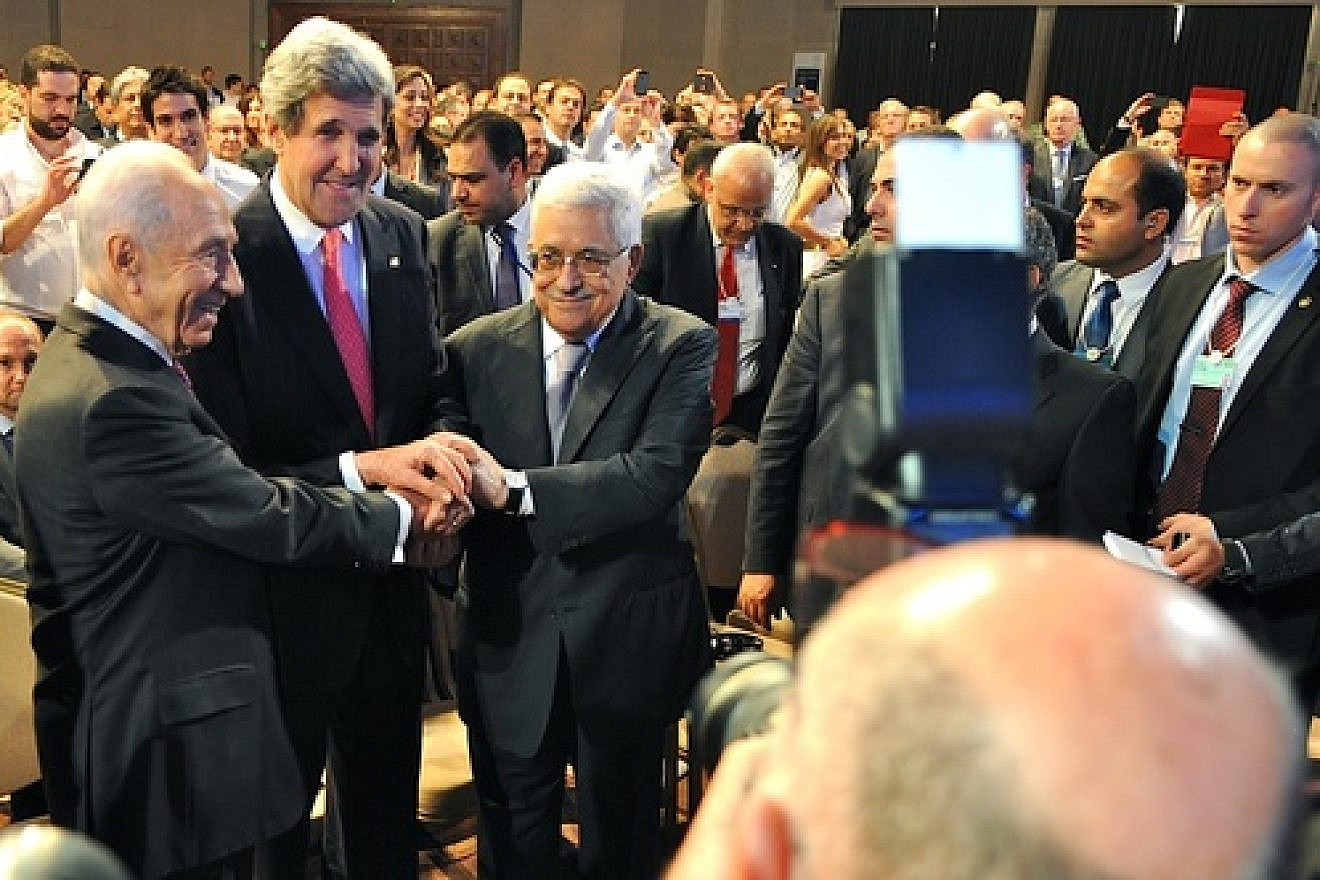 Israeli President Shimon Peres, U.S. Secretary of State John Kerry, and Palestinian Authority leader Mahmoud Abbas join in a handshake at the World Economic Forum in Jordan, on May 26, 2013. In American-brokered Israeli-Palestinian conflict talks, both sides have exhibited declining trust in the U.S. Credit: U.S. State Department.