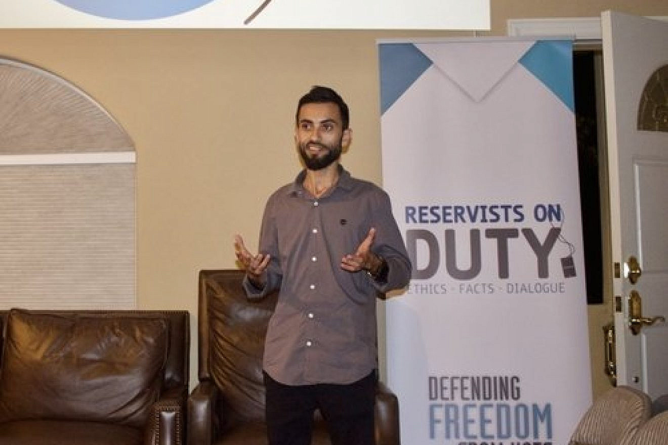 A representative of Reservists on Duty (RoD) speaks Monday night at Stanford Chabad as part of a program highlighting the stories of Israeli minorities. After the Stanford Israel Association and Stanford Hillel withdrew from the RoD event, Chabad agreed to host it. Credit: Stanford Chabad.