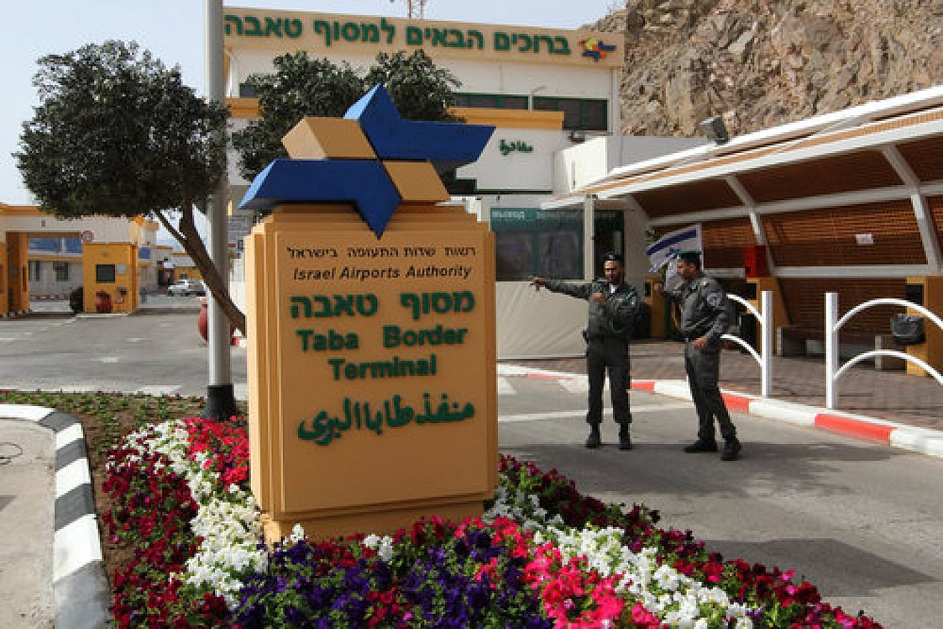 A wounded Israeli man is wheeled from Egypt to Israel, through the Taba border crossing, following a bombing at the Hilton Taba hotel in the Egyptian Sinai Peninsula, Oct. 7, 2004. Credit: Flash90.
