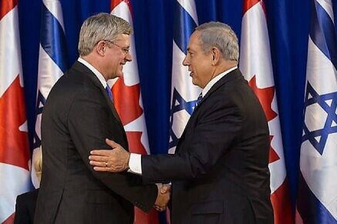 Israeli Prime Minister Benjamin Netanyahu shakes hands with Canadian Prime Minister Stephen Harper during a welcoming ceremony for Harper at Netanyahu's office in Jerusalem on Jan.19, 2014. Photo by Flash90.