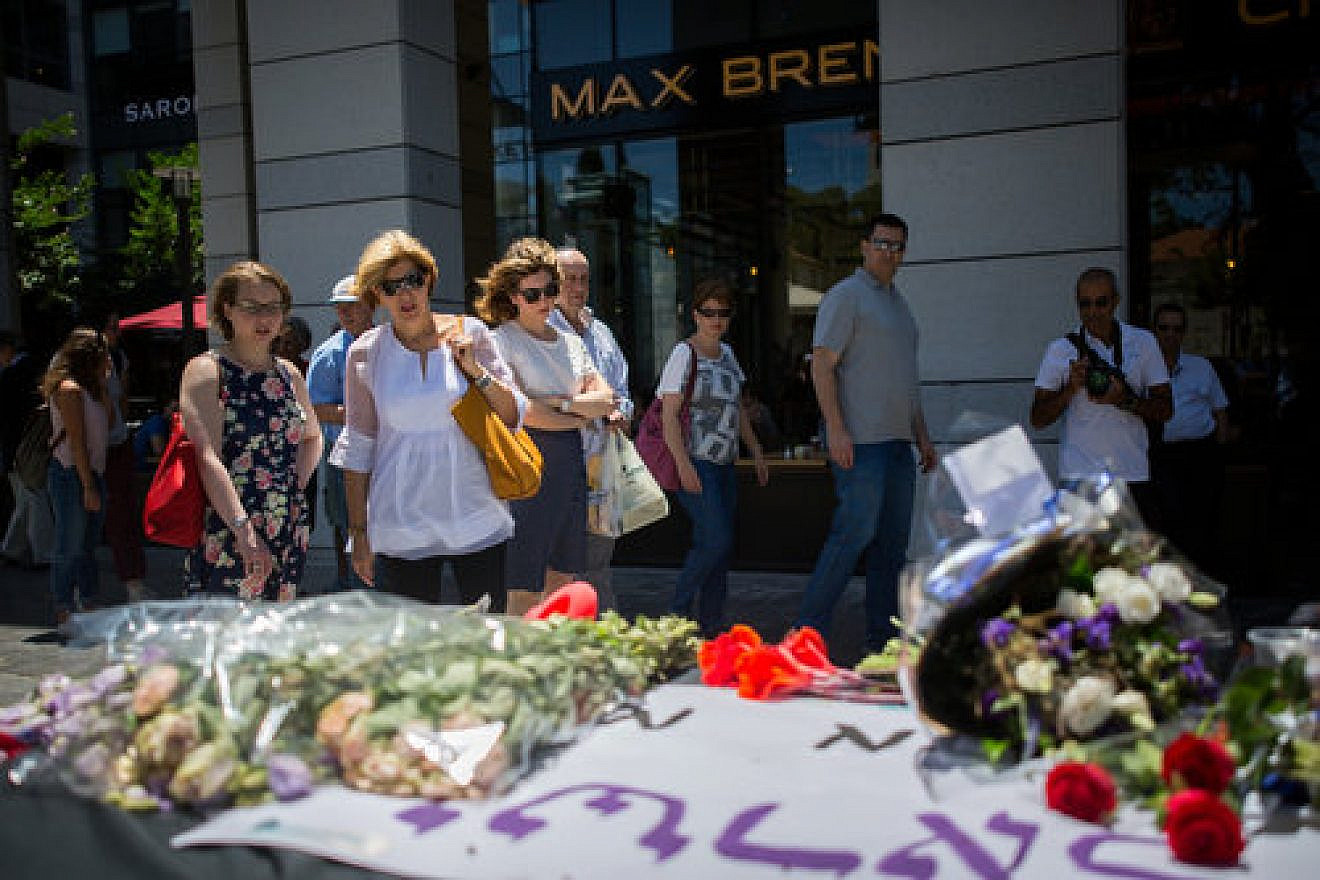 A makeshift memorial at the site of the June 2016 Palestinian terrorist shooting at Tel Aviv’s Sarona market. Four Israelis were killed in the attack. Credit: Miriam Alster/Flash90.